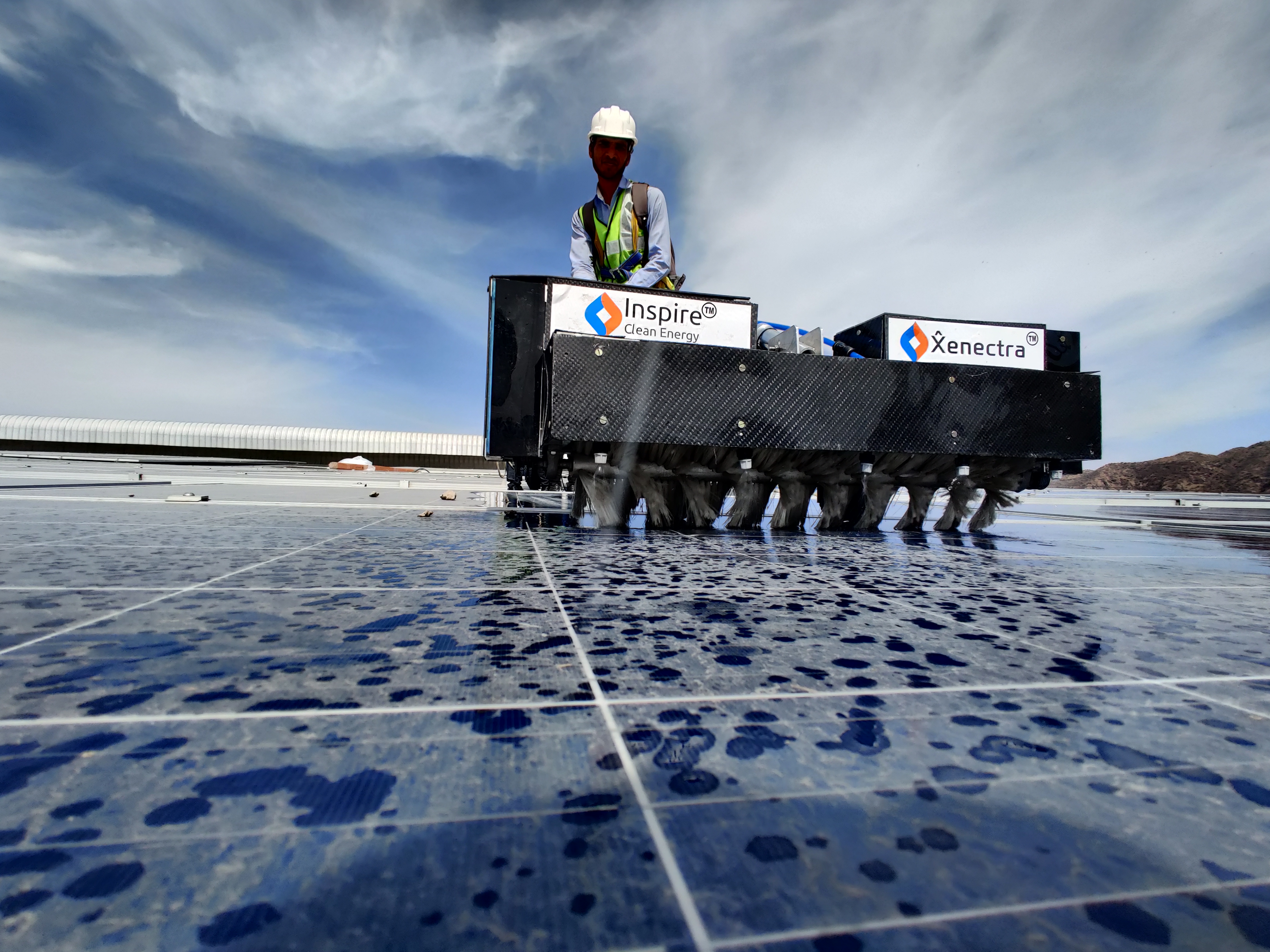CoBOT600 used for cleaning the dust in the roof top solar panels by a worker in the inspire clean energy